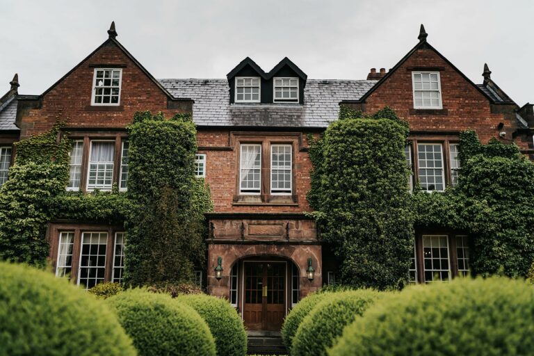 Nunsmere Hall exterior shot with hedges