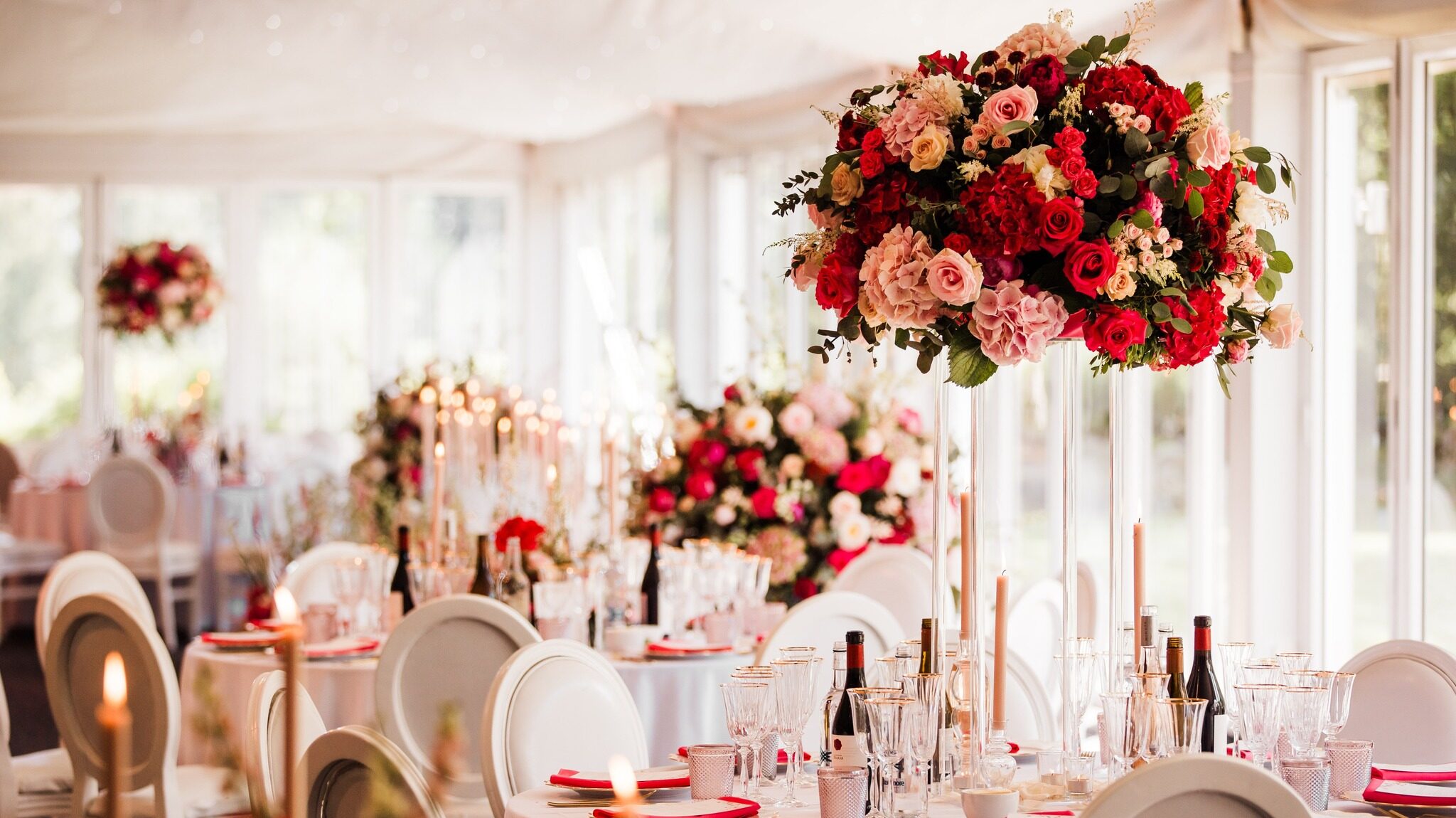 Nunsmere Hall marquee wedding decorated with roses